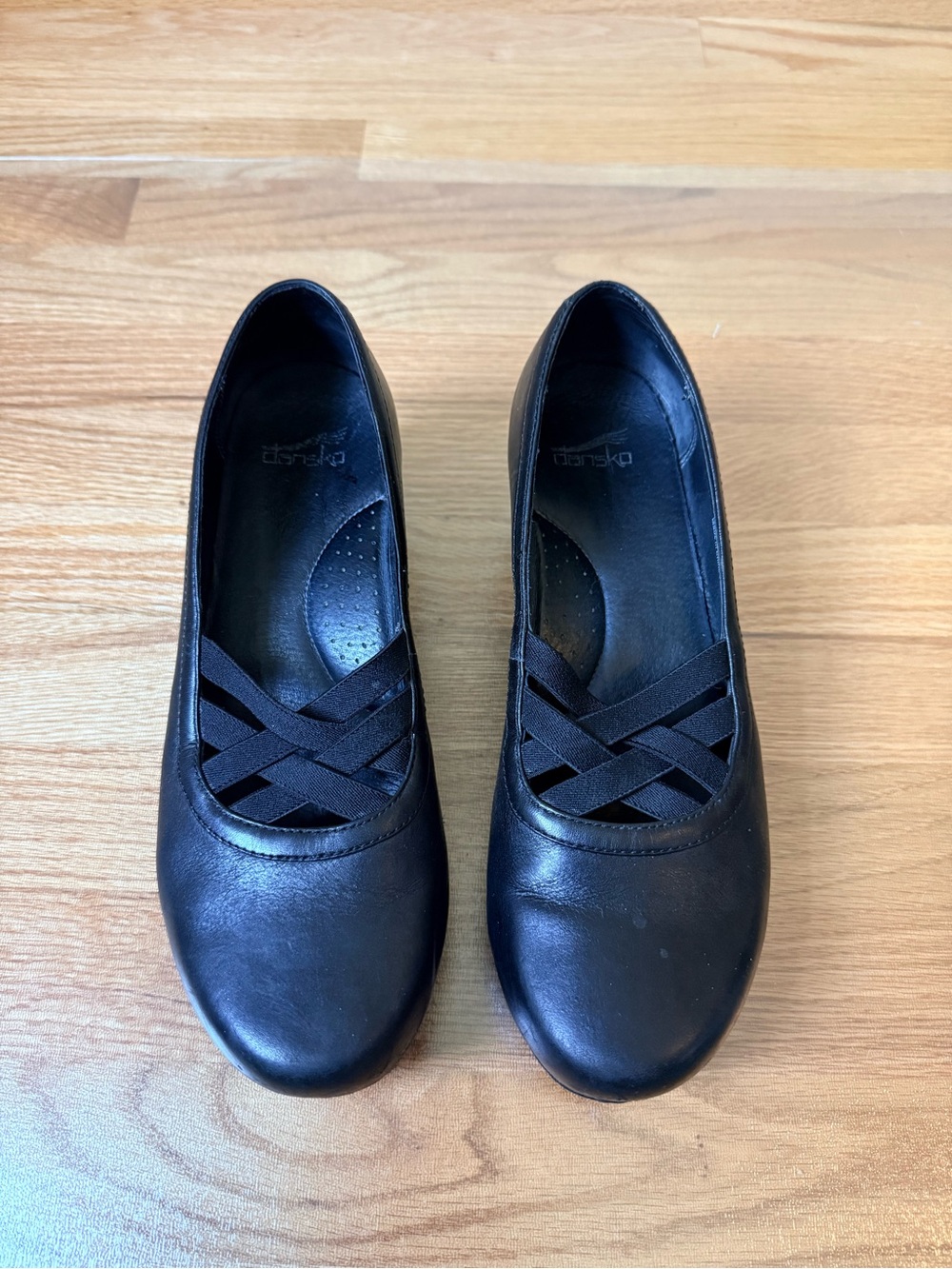 Dansko Black Leather Slip-On Clogs with Crisscross Elastic Detail